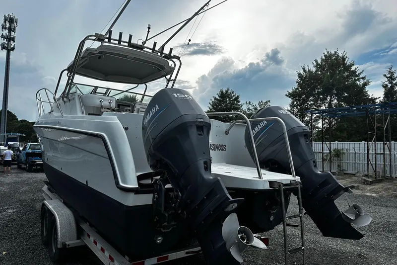 Slide: The Image of 2006 Glacier Bay 2670 boat with dual Yamaha engines on a trailer. - 3