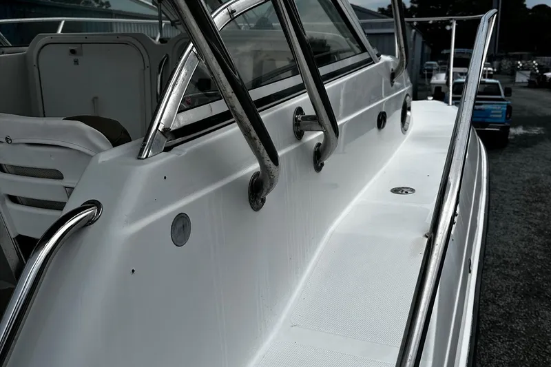 Slide: The Image of 2006 Glacier Bay 2670 boat with stainless steel railings and white deck. - 8