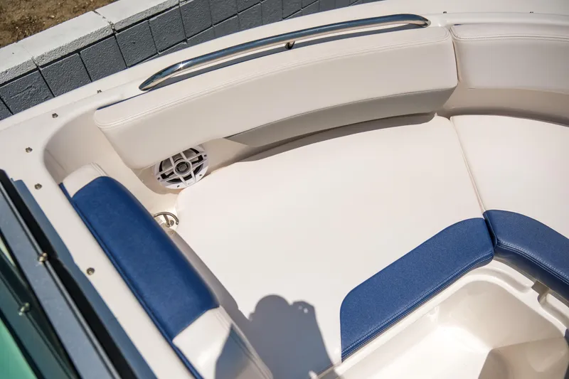 Slide: The Image of 2021 Robalo R227 Dual Console boat interior with blue and white seating. - 10