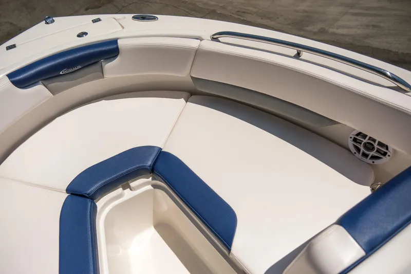 Slide: The Image of 2021 Robalo R227 Dual Console boat interior with blue and white seating. - 11