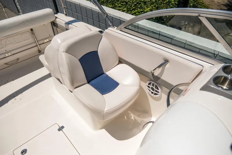 Slide: The Image of 2021 Robalo R227 Dual Console boat interior with white and blue seating. - 15
