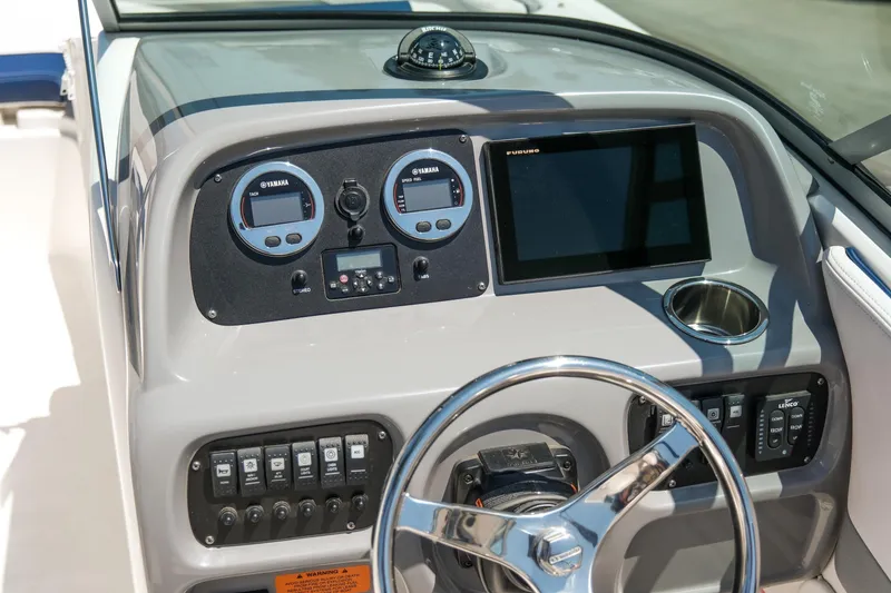 Slide: The Image of 2021 Robalo R227 Dual Console dashboard with Yamaha gauges and Furuno display. - 17