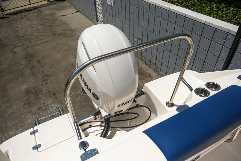 Slide: The Image of 2021 Robalo R227 Dual Console boat with Yamaha outboard motor, docked outdoors. - 27