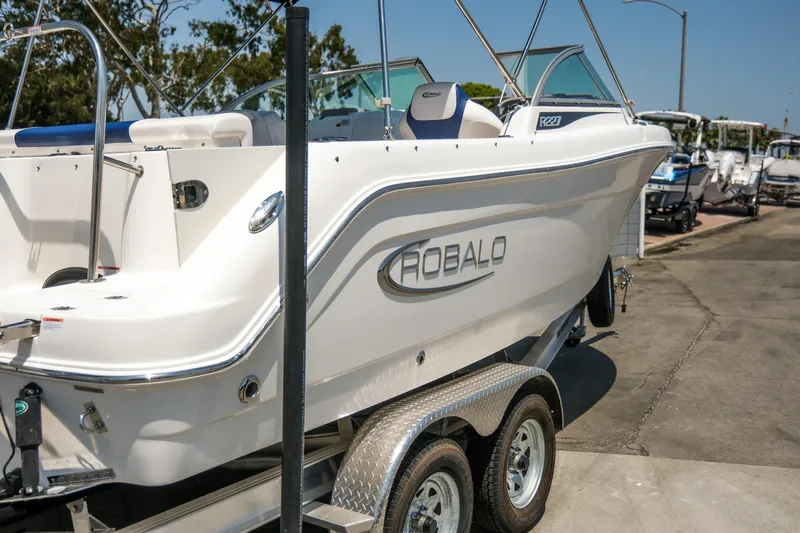 Slide: The Image of 2021 Robalo R227 Dual Console boat on trailer, side view. - 29