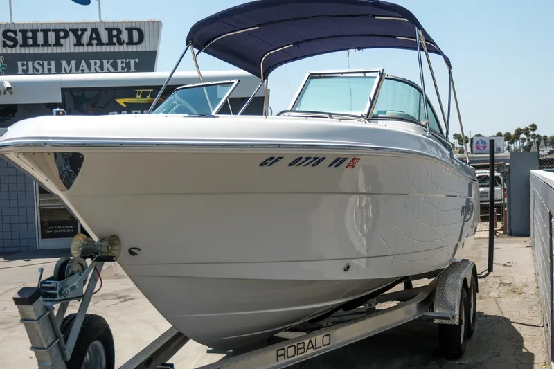 Slide: The Image of 2021 Robalo R227 Dual Console boat on trailer at shipyard. - 3