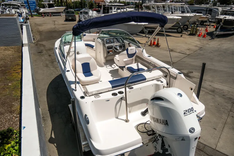Slide: The Image of 2021 Robalo R227 Dual Console boat with Yamaha 200 engine, docked at marina. - 7