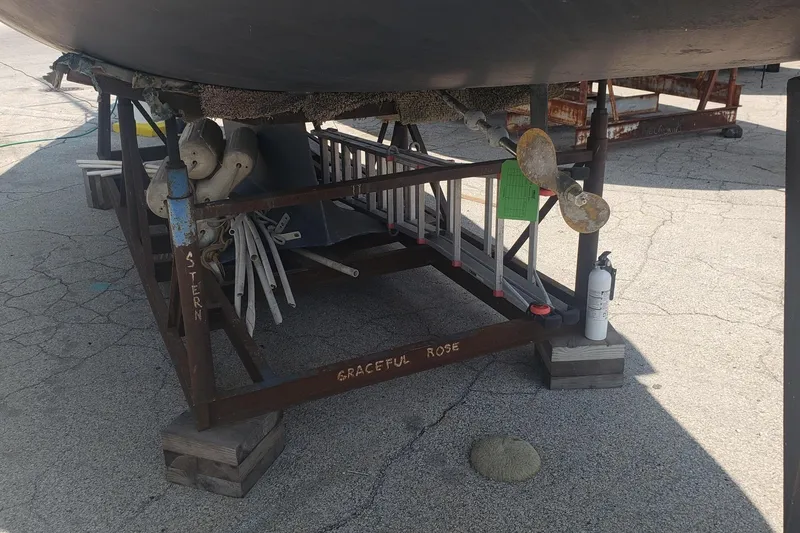 Slide: The Image of Hunter 30 sailboat from 1994 on a stand, labeled "Graceful Rose," with visible propeller. - 5