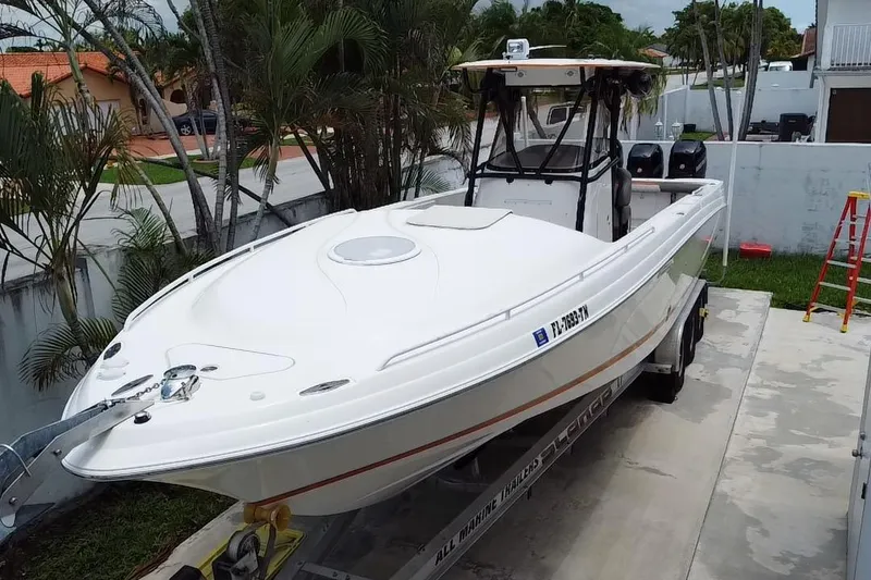 Slide: The Image of Aerial view of 2007 Scarab 35 Sport boat parked near a house. - 13