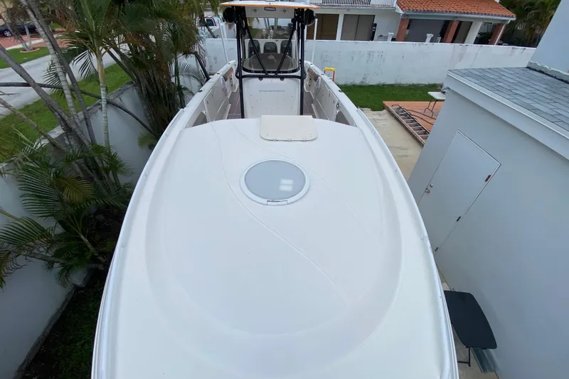 Slide: The Image of 2007 Scarab 35 Sport boat, top view, docked near residential area. - 14