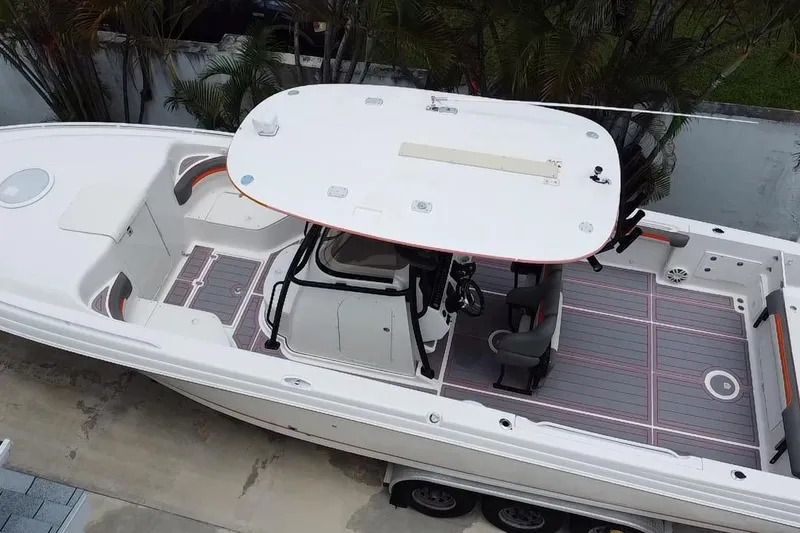 Slide: The Image of 2007 Scarab 35 Sport boat, aerial view, showcasing spacious deck and seating arrangement. - 17