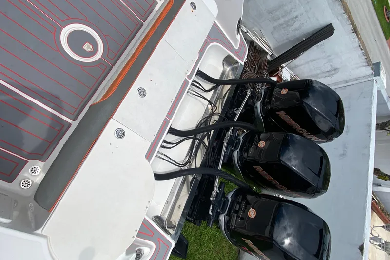 Slide: The Image of 2007 Scarab 35 Sport boat with triple Mercury outboard engines, top view. - 19