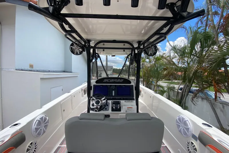 Slide: The Image of 2007 Scarab 35 Sport boat interior with modern controls and seating. - 21