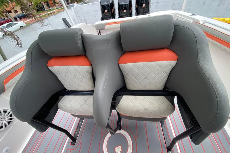 Slide: The Image of Luxury seating on 2007 Scarab 35 Sport boat with quilted design and orange accents. - 22
