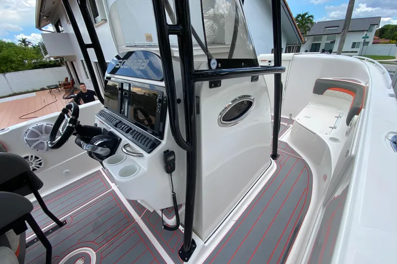 Slide: The Image of 2007 Scarab 35 Sport boat interior with modern dashboard and seating. - 23