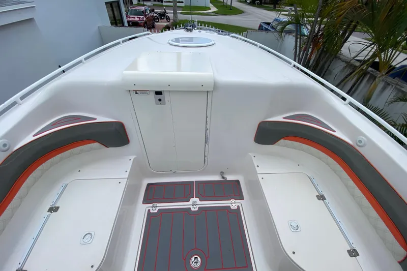 Slide: The Image of 2007 Scarab 35 Sport boat interior with sleek seating and storage compartments. - 27