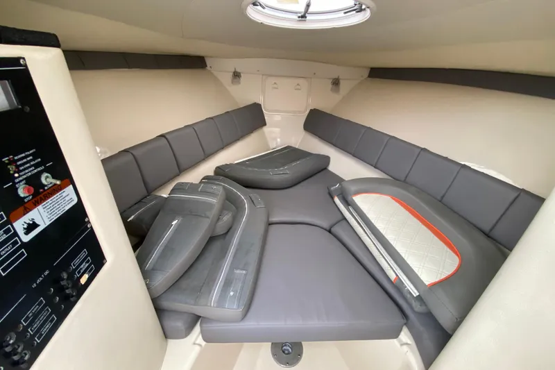 Slide: The Image of 2007 Scarab 35 Sport cabin interior with cushioned seating and control panel. - 28