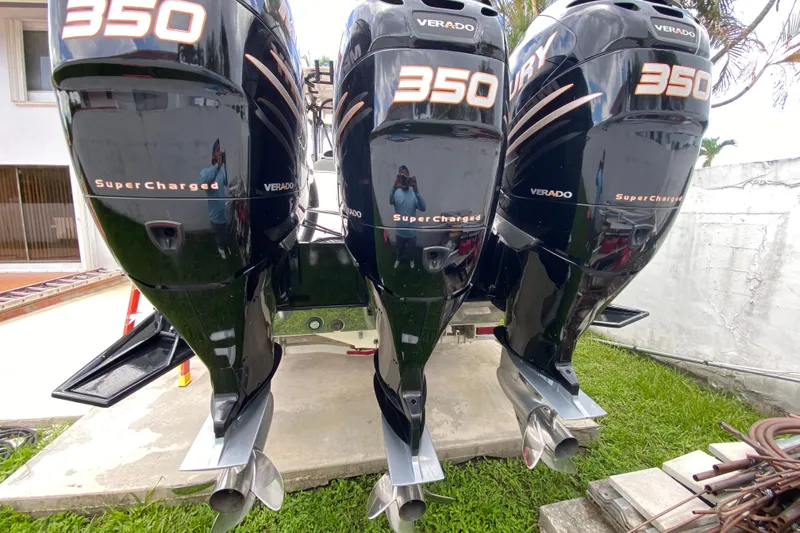 Slide: The Image of Triple Mercury Verado 350 engines on a 2007 Scarab 35 Sport boat. - 34