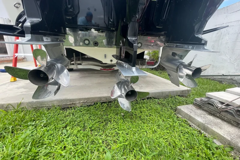 Slide: The Image of Rear view of 2007 Scarab 35 Sport boat propellers on grass. - 36