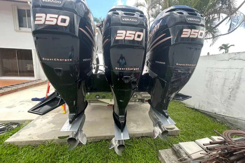 Slide: The Image of Triple Mercury Verado 350 engines on a 2007 Scarab 35 Sport boat. - 37