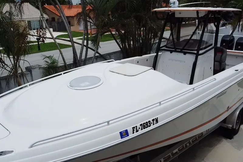 Slide: The Image of Aerial view of a 2007 Scarab 35 Sport boat parked near a house. - 4