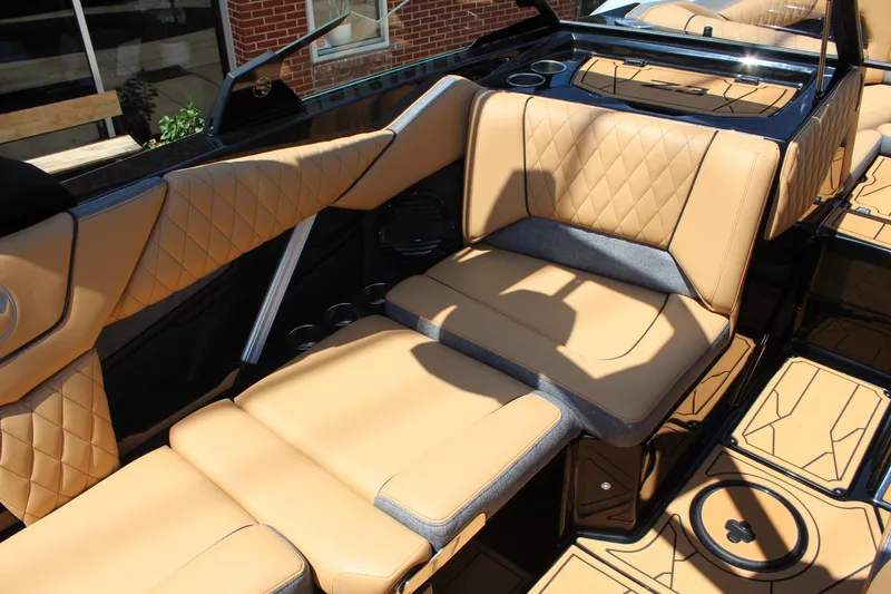 Slide: The Image of Luxurious interior of 2026 Tigé Z3 boat with tan quilted seating and sleek design. - 13