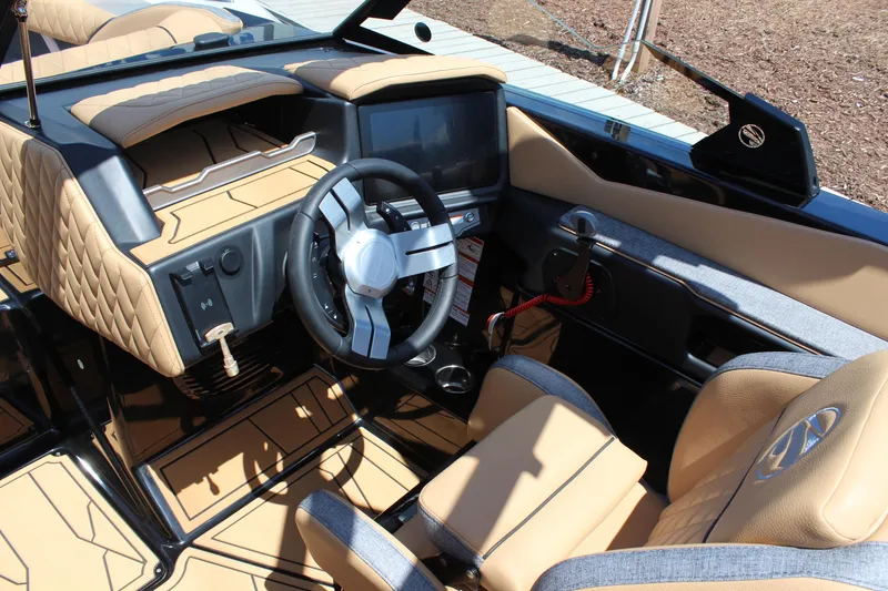 Slide: The Image of 2026 Tigé Z3 boat interior with modern dashboard and tan leather seating. - 16