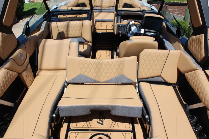 Slide: The Image of Luxurious interior of 2026 Tigé Z3 boat with tan quilted seating and modern design. - 18