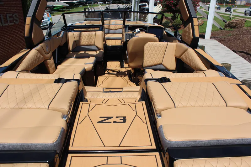 Slide: The Image of 2026 Tigé Z3 boat interior with luxurious tan seating and modern design. - 3