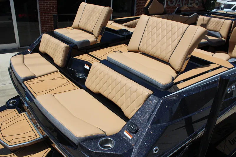 Slide: The Image of 2026 Tigé Z3 boat with luxurious tan seating and sleek design. - 5