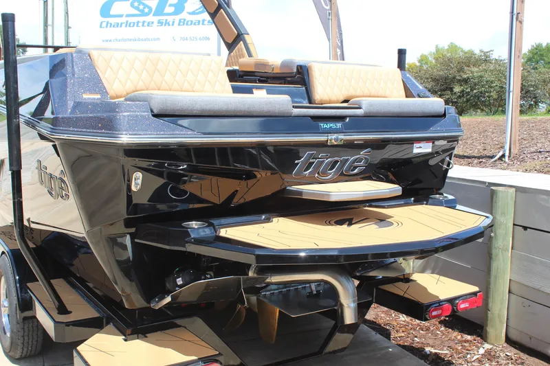 Slide: The Image of 2026 Tigé Z3 boat rear view with sleek design and luxurious seating. - 6