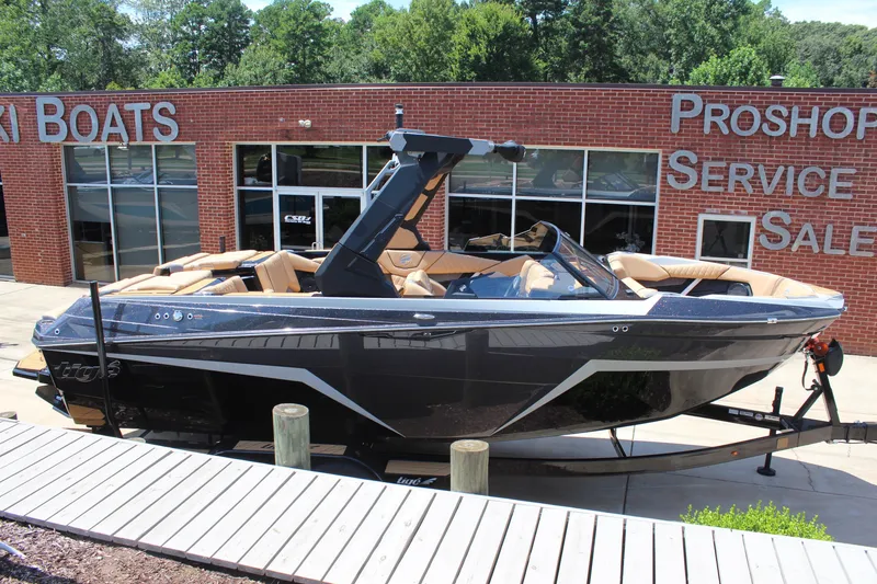 Slide: The Image of 2026 Tigé Z3 boat displayed at a dealership, featuring sleek design and modern amenities. - 8