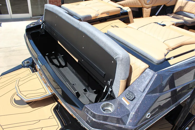 Slide: The Image of 2026 Tigé Z3 boat with open storage compartment and luxurious seating. - 9