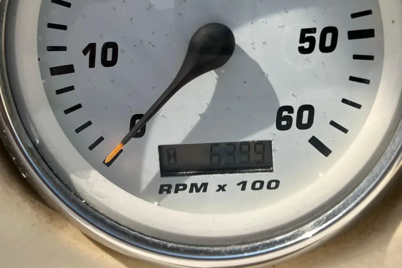 Slide: The Image of Close-up of Larson 330 Cabrio 2000 tachometer showing 6399 RPM x 100. - 29