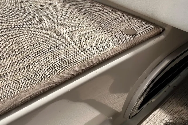 Slide: The Image of 2000 Larson 330 Cabrio boat interior with dashboard and marina view. - 7