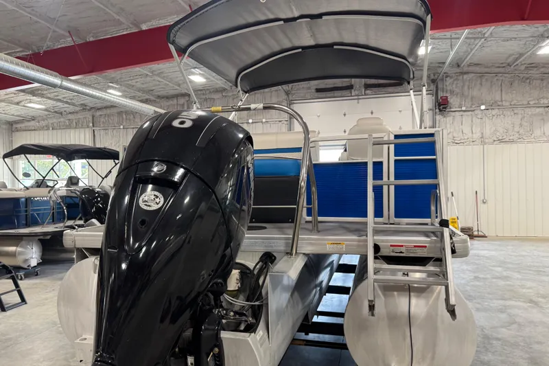 Slide: The Image of 2019 Sweetwater 2486 pontoon boat with outboard motor in a showroom. - 5