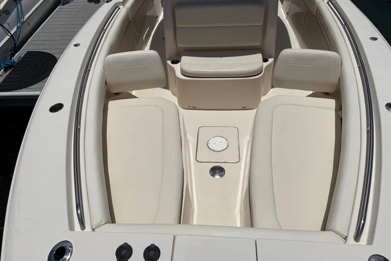 Slide: The Image of 2020 Grady-White Canyon 306 boat interior with cushioned seating and storage compartments. - 9