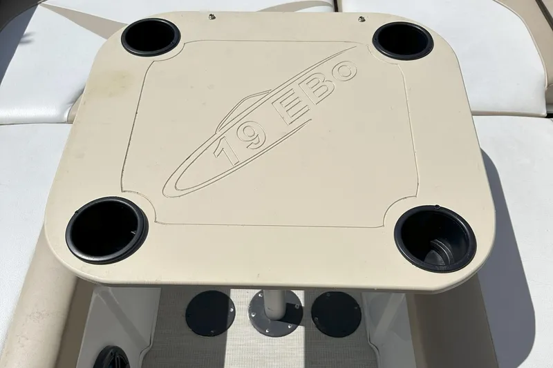 Slide: The Image of 2021 Caravelle 19 EBo Bowrider table with cup holders on boat deck. - 16
