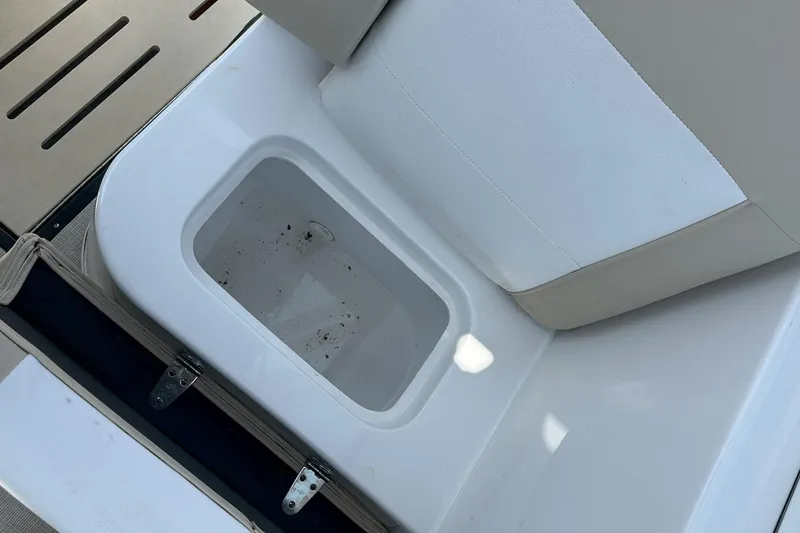 Slide: The Image of 2021 Caravelle 19 EBo Bowrider boat seat with built-in storage compartment. - 20