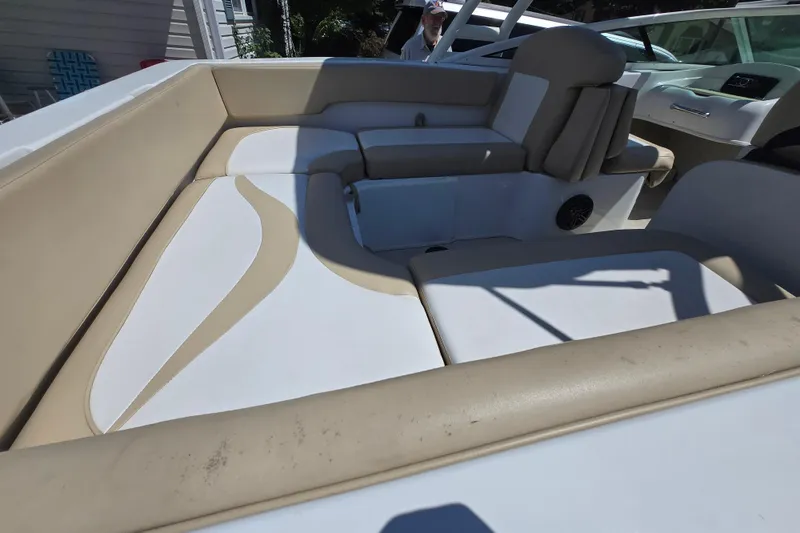 Slide: The Image of 2021 Caravelle 19 EBo Bowrider interior with beige and white seating. - 4