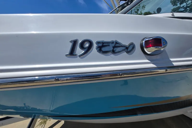 Slide: The Image of 2021 Caravelle 19 EBo Bowrider boat, close-up of model name and light. - 9