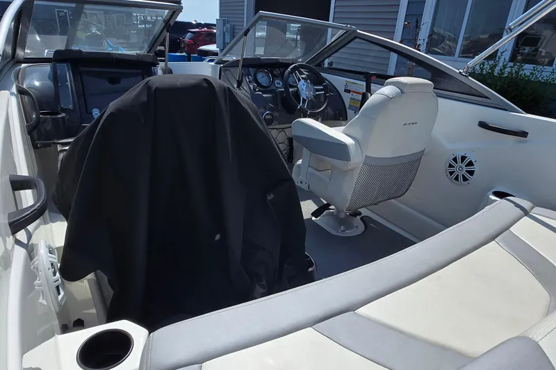 Slide: The Image of 2014 Larson LX 195S IO boat interior with steering wheel and seating. - 5