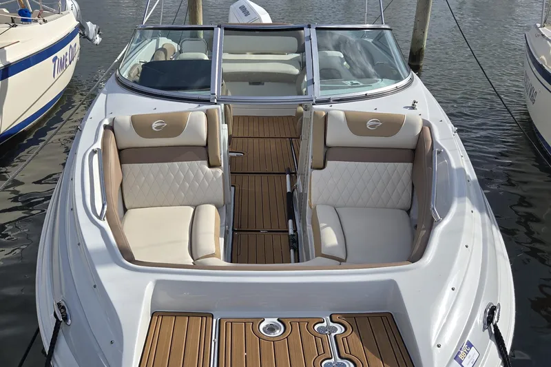 Slide: The Image of 2023 Crownline Eclipse E235 XS boat with elegant seating and teak flooring. - 3