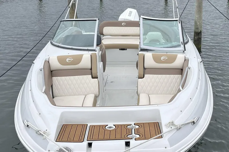 Slide: The Image of 2023 Crownline Eclipse E235 XS boat with elegant seating and sleek design. - 4