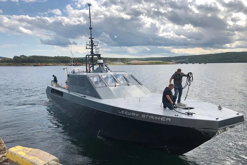 The Image of River Hawk 73 Sea Stryker Fast Patrol Boat, 2012, docked with crew on deck. - 0