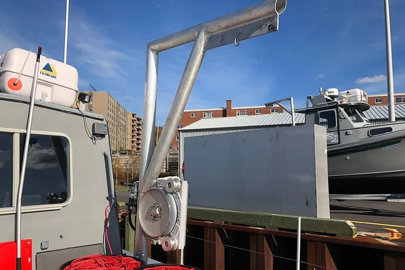 Slide: The Image of River Hawk 73 Sea Stryker Fast Patrol Boat, 2012, docked with equipment visible. - 14