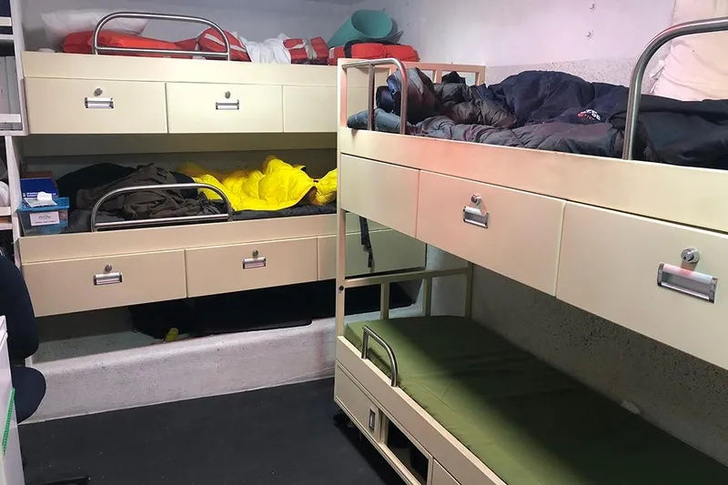 Slide: The Image of Bunk beds in 2012 River Hawk 73 Sea Stryker Fast Patrol Boat cabin interior. - 16