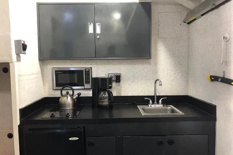 Slide: The Image of Compact kitchen area on 2012 River Hawk 73 Sea Stryker Fast Patrol Boat. - 17