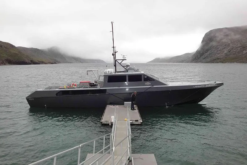 Slide: The Image of River Hawk 73 Sea Stryker Fast Patrol Boat, 2012, docked in scenic coastal waters. - 2