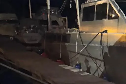 Slide: The Image of 2012 Riverhawk 73 Sea Stryker Fast Patrol Boat docked at night. - 25