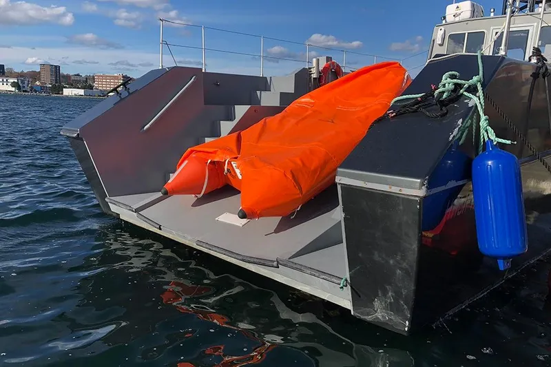 Slide: The Image of River Hawk 73 Sea Stryker Fast Patrol Boat, 2012, with orange inflatable raft on deck. - 27